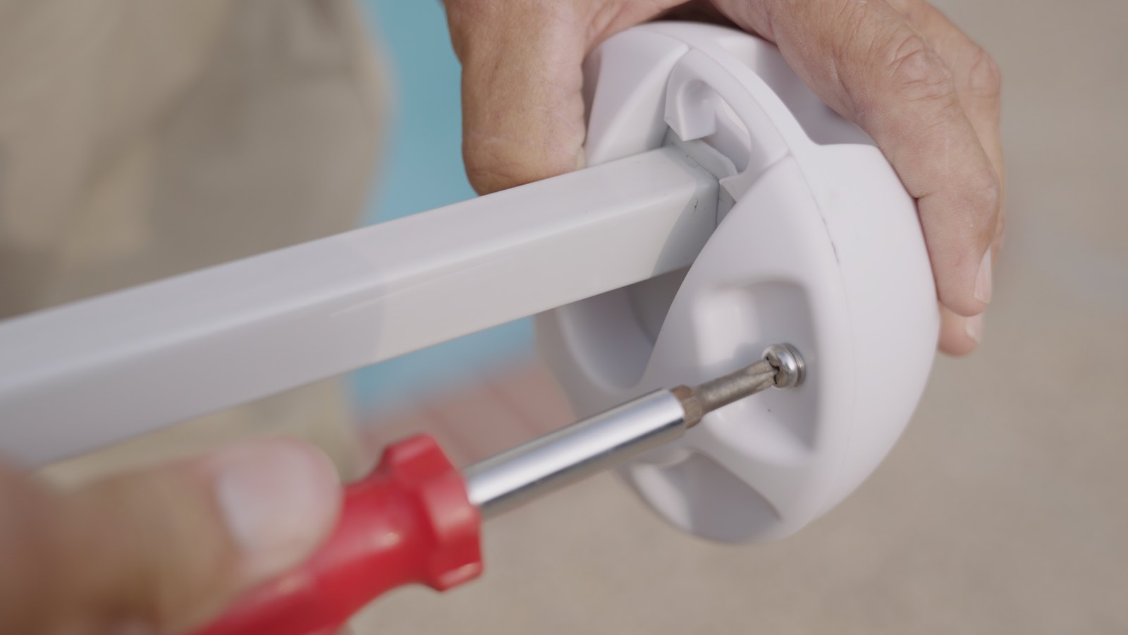 Stainless screws being tightened into a Canopy Turtle on a canopy leg.